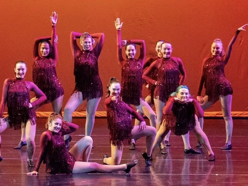 JazzswingDance Performance In Burgundy Fringe Costumes