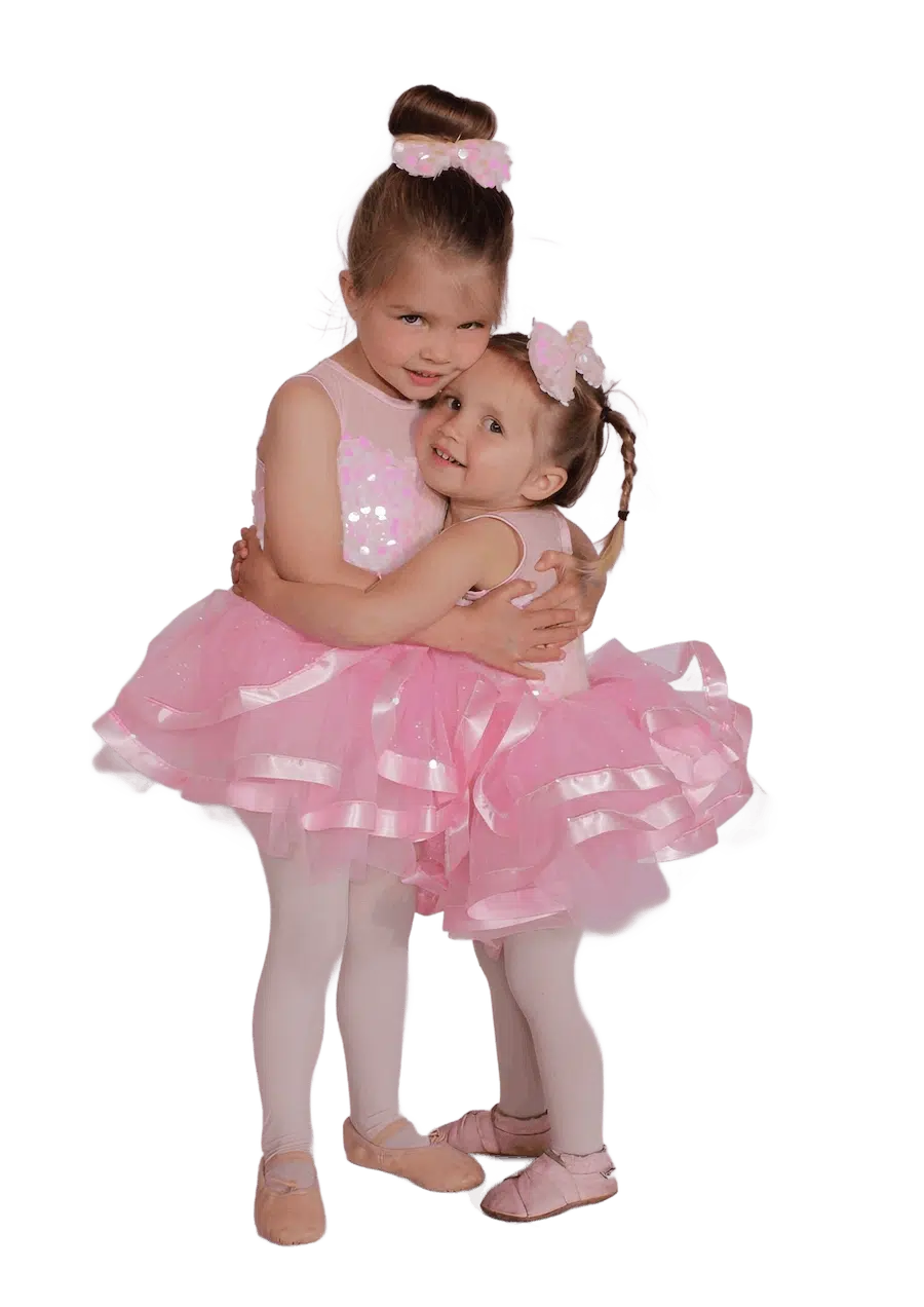 Young Ballet Dancers In Matching Pink Costumes
