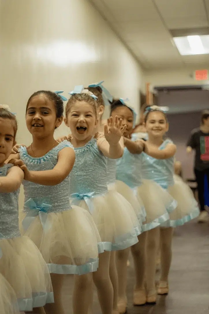 Young Dancers Lined Up Backstage In Tutu Costumes